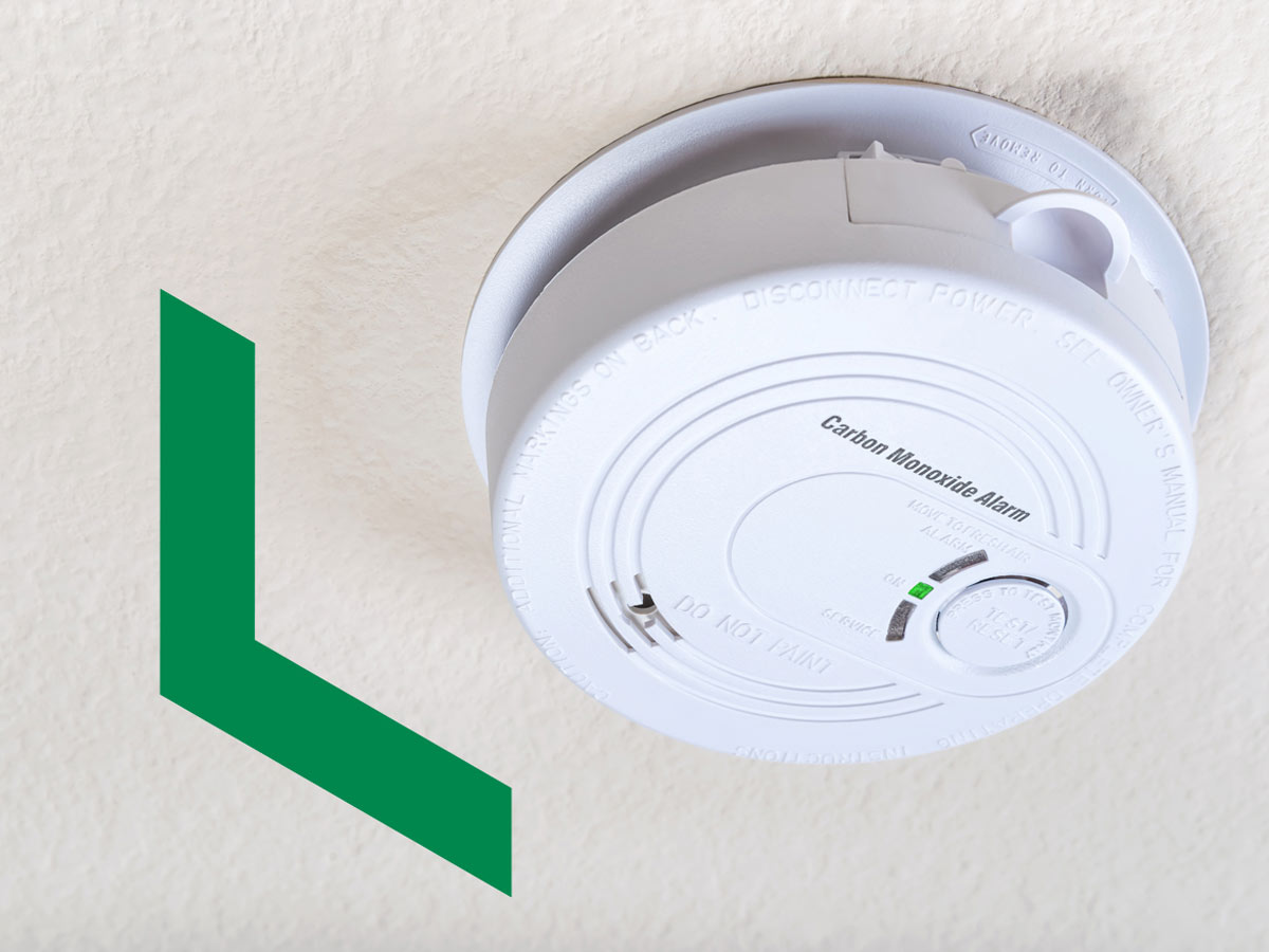 A carbon monoxide alarm on the ceiling to detect unsafe levels of carbon monoxide.