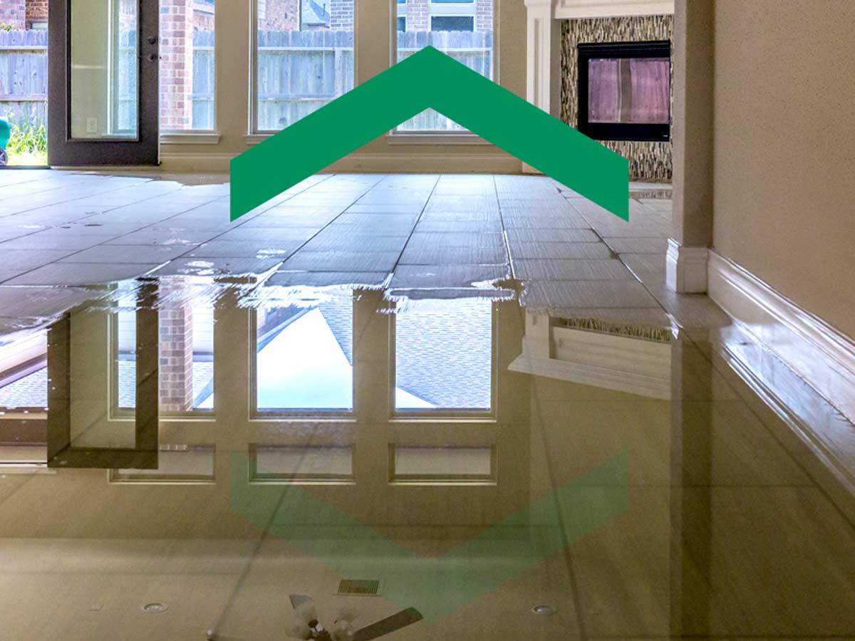 Water covers the floor of an empty home.